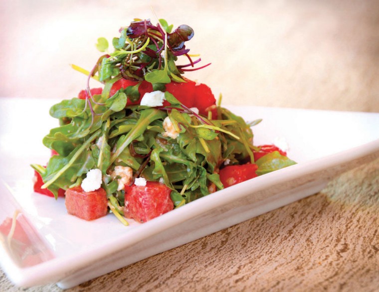 Grilled watermelon with baby arugula and goat cheese salad